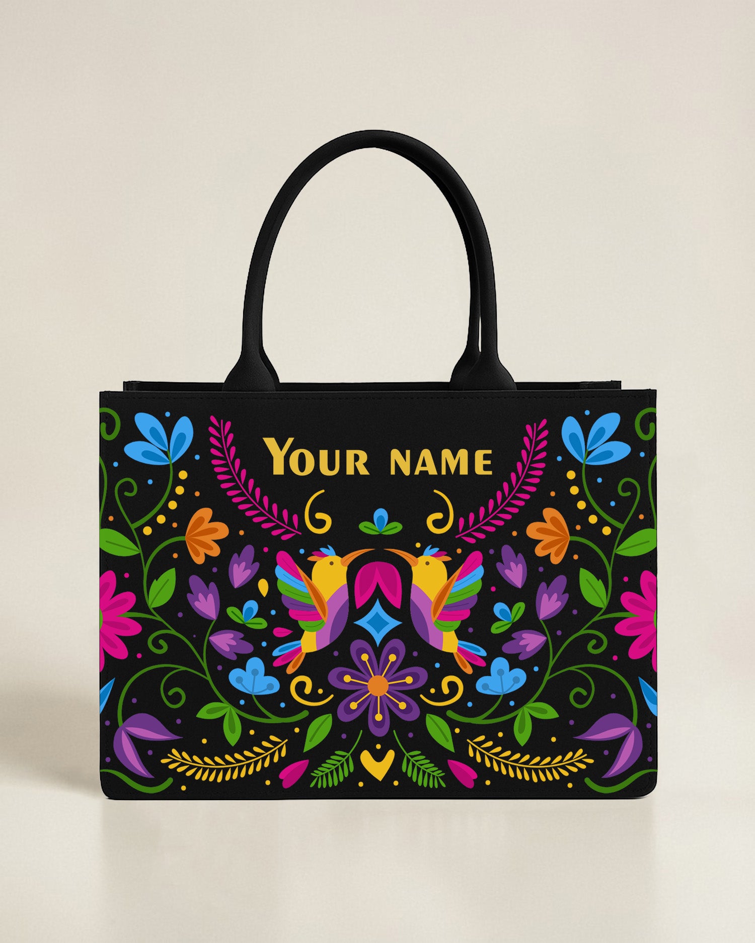 Black tote bag featuring a centered illustration of an owl and moth surrounded by vibrant flowers and a custom name in matching blue font.