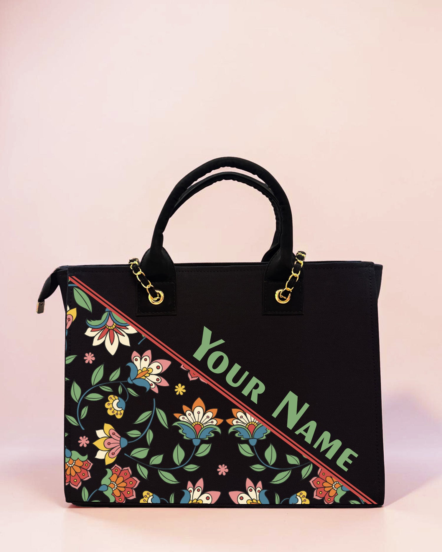 Personalized black tote bag featuring colorful ethnic floral artwork and custom name print on a pastel background.