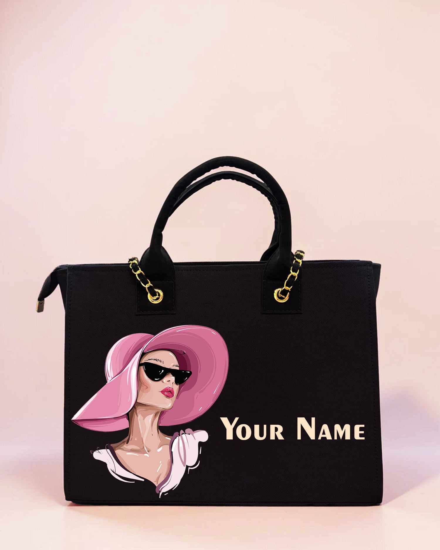 Personalized black tote bag featuring elegant fashion girl illustration with pink hat and custom name print on a pastel background.