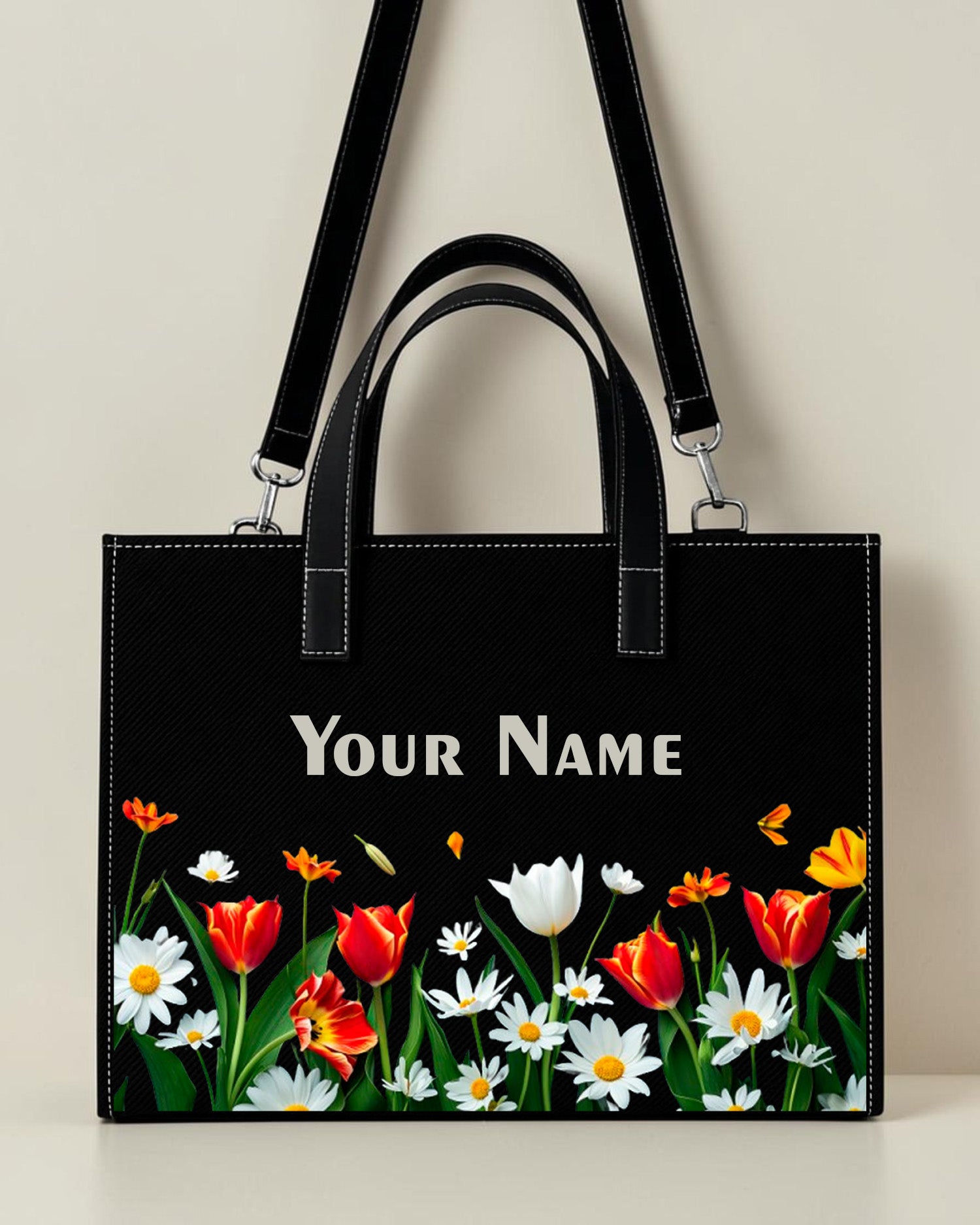 Personalized black floral sling tote bag with tulip and daisy flower print and custom name