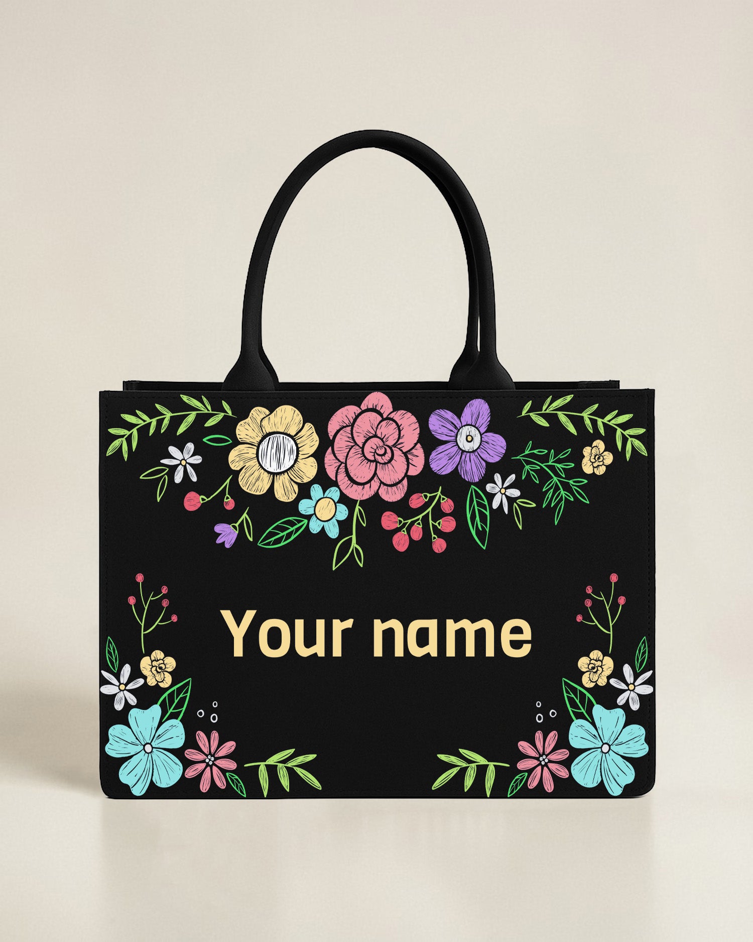 Black canvas tote bag featuring a repeating pattern of white and yellow daisies in a grid layout, with a solid black horizontal bar containing a custom name.